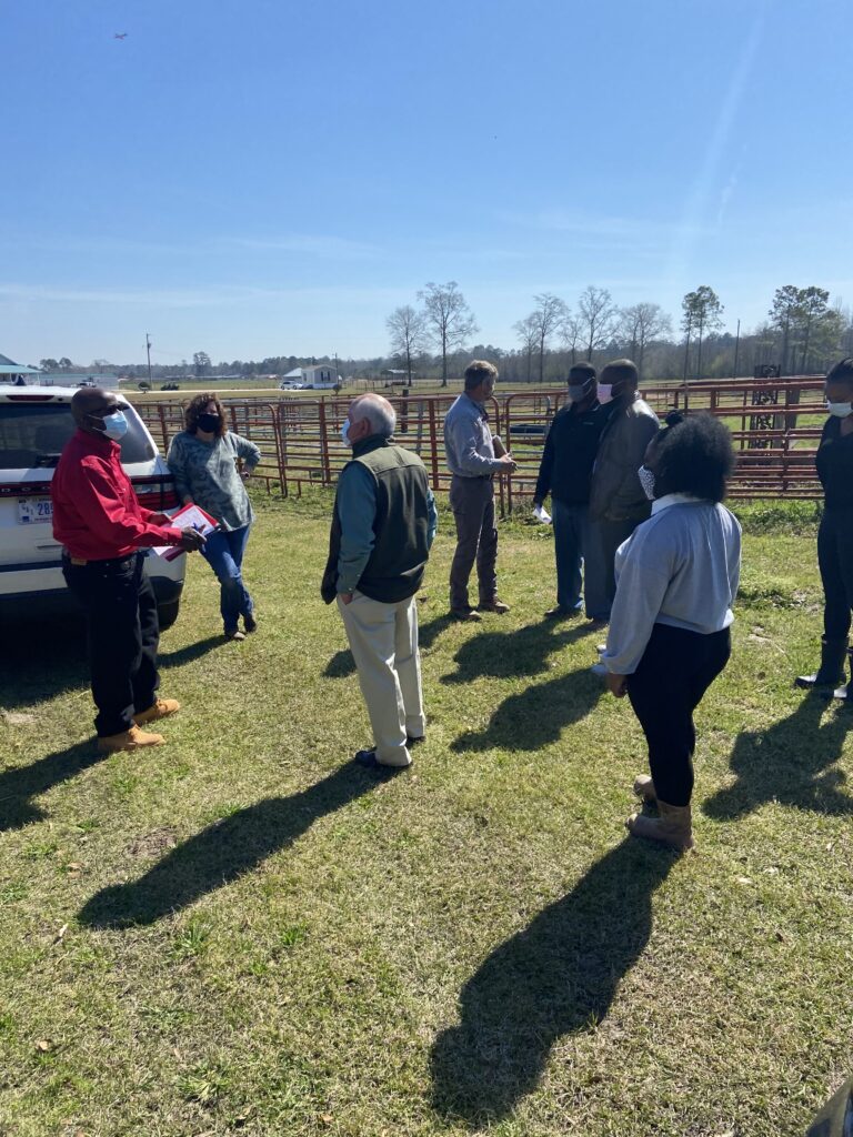 A group standing together in a field at Wandalands Vineyard & Orchards