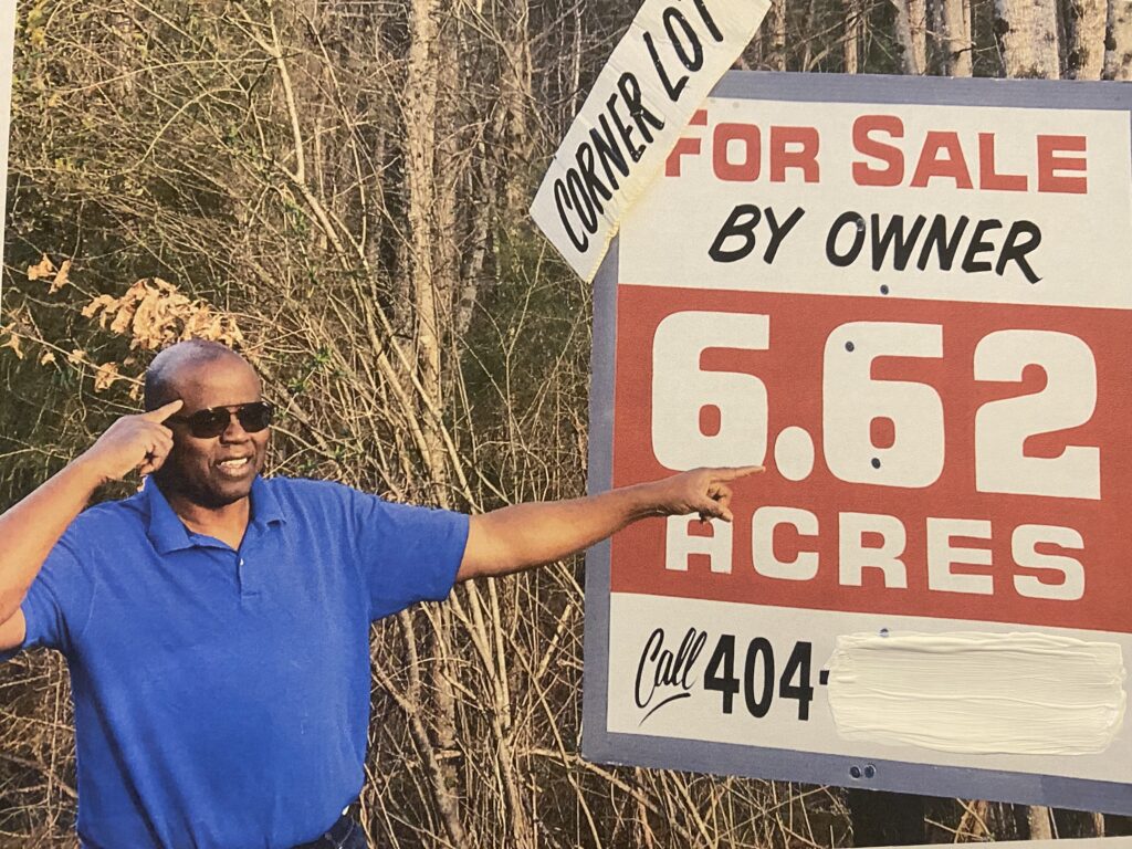 Jerome Brown beside the for-sale sign on the Jackson, Georgia acreage that became Wandalands