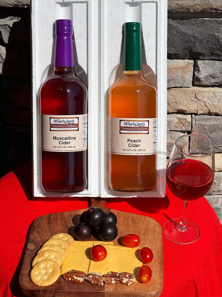 Two bottles of Wandalands muscadine cider