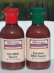 Wandaland’s Hot BBQ Sauce with a red cap beside Smokey BBQ Sauce with a green cap.